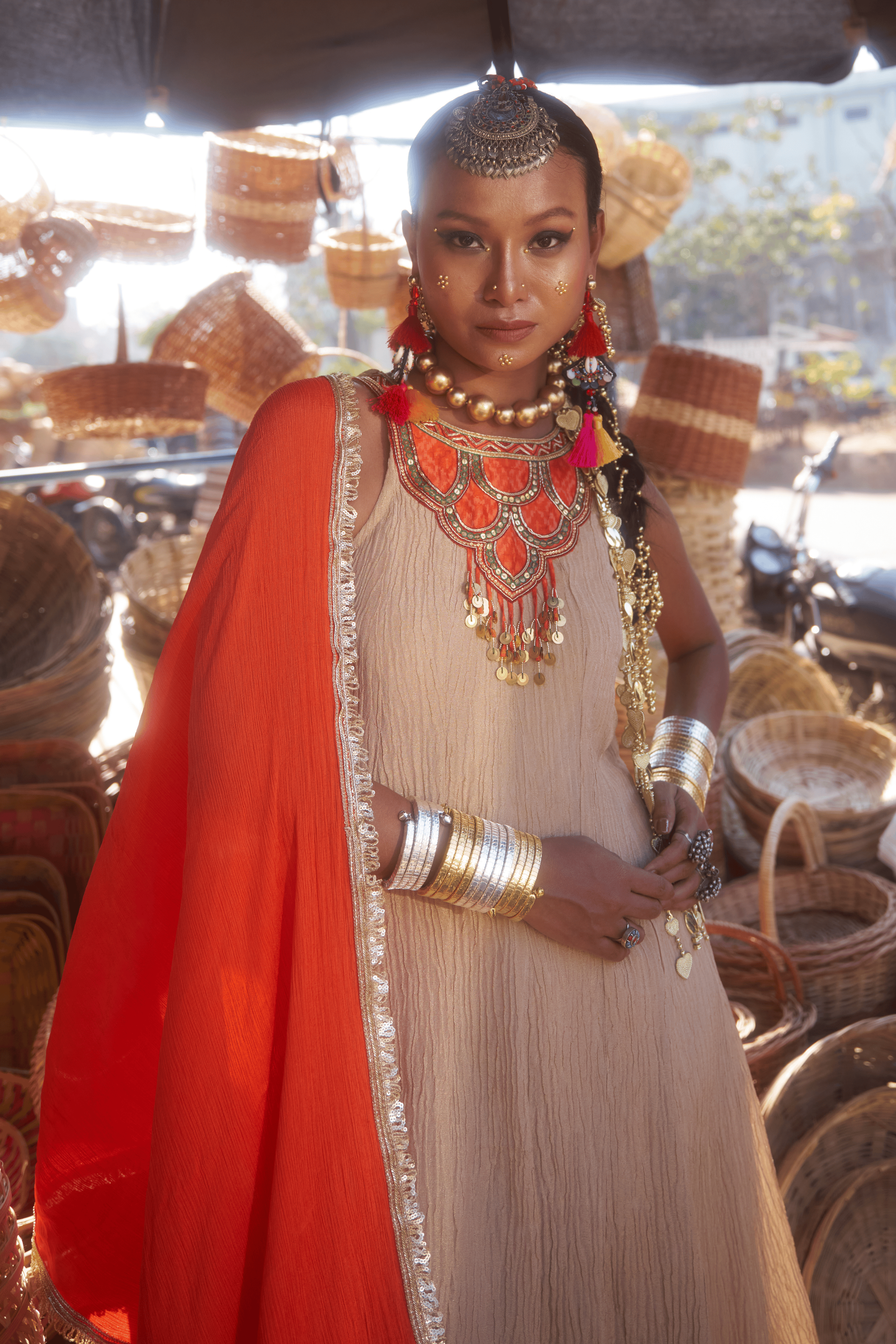 Woman in traditional anarkali with chiffon dupatta in a market setting