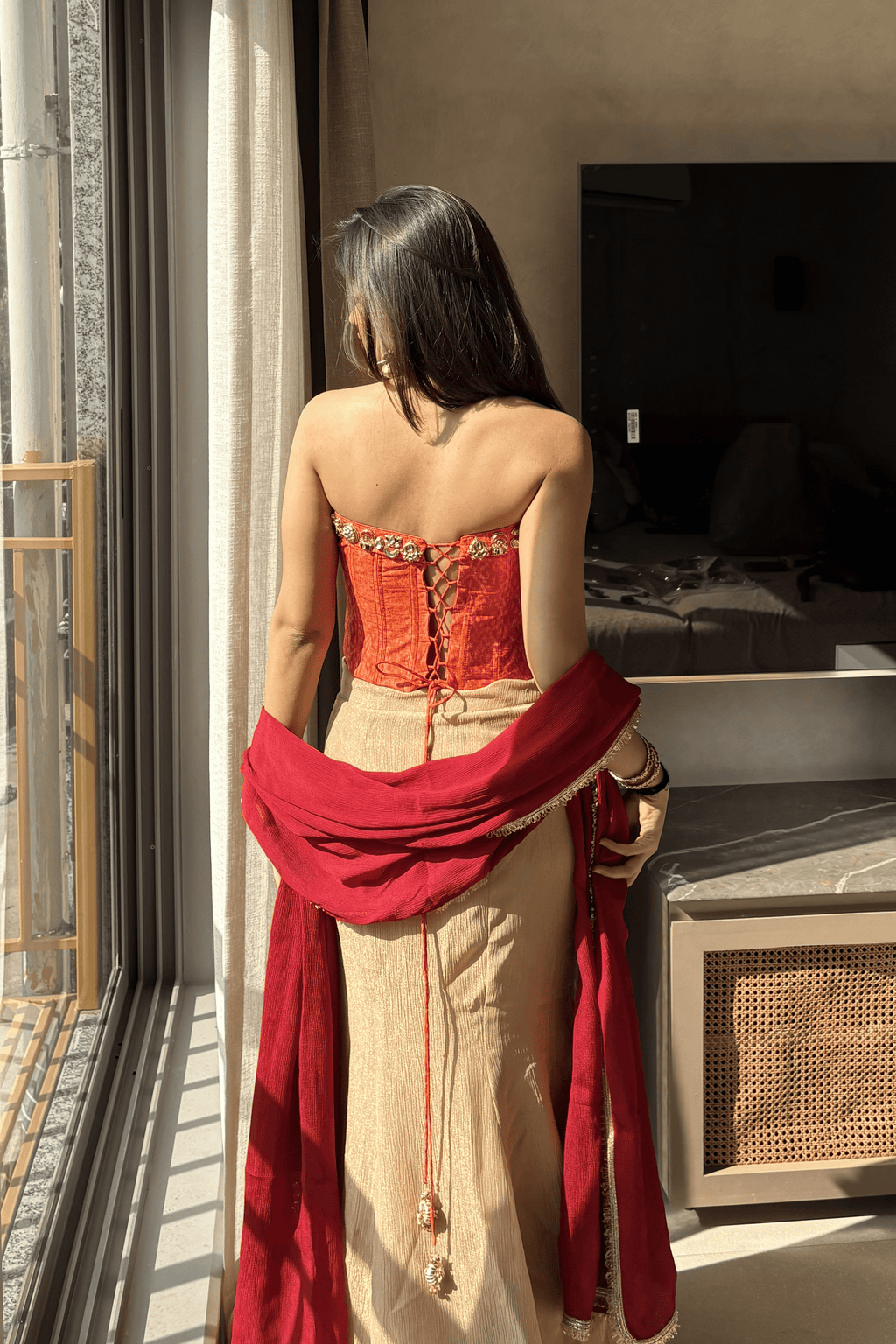 Ruhani - Rose Gold Fishcut Lehenga Set with Orange Hand Embroidered Ikat Corset